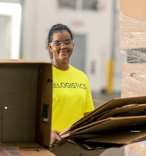 Woman worker holding break pack boxes