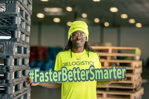 employee holding sign that says faster better smarter