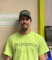 Ryan Haldeman, Knoxville RLC Safety Champion at Relogistics, wearing a bright yellow shirt with "RELOGISTICS" logo, promoting workplace safety culture.