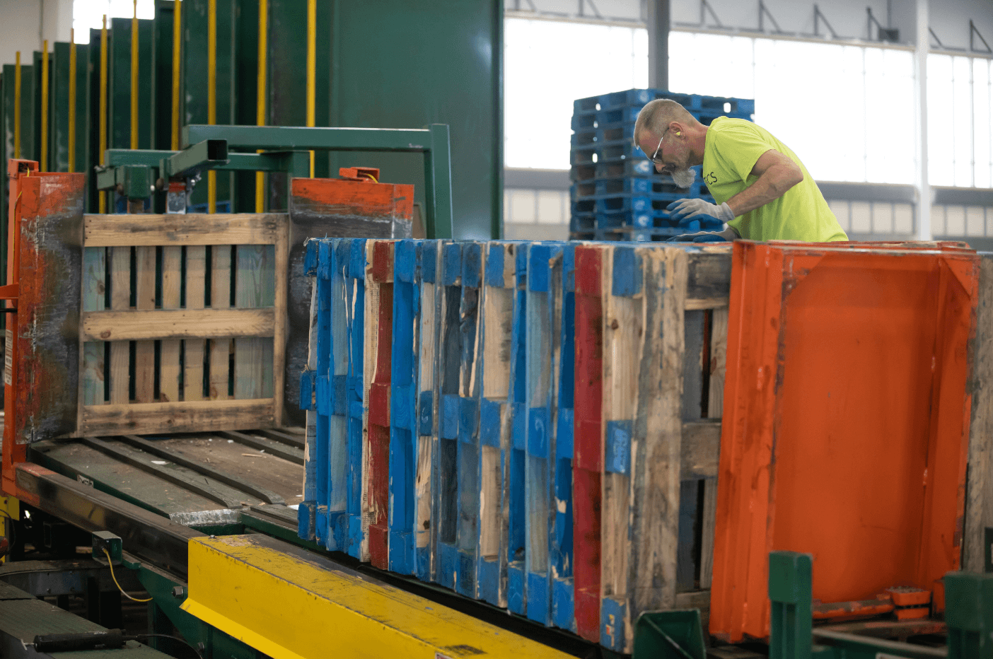 man in warehouse with pallets